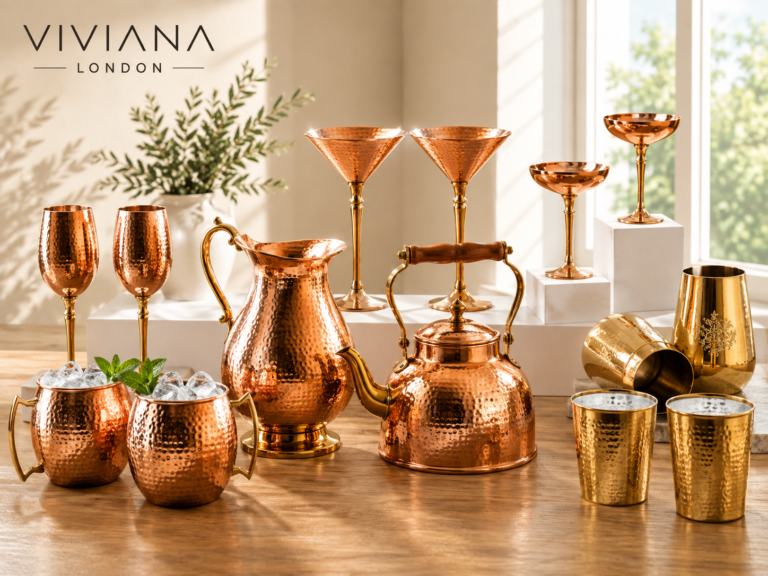 Handcrafted copper wine glasses, pitcher, and brass spice box by Viviana London for mindful slow living.