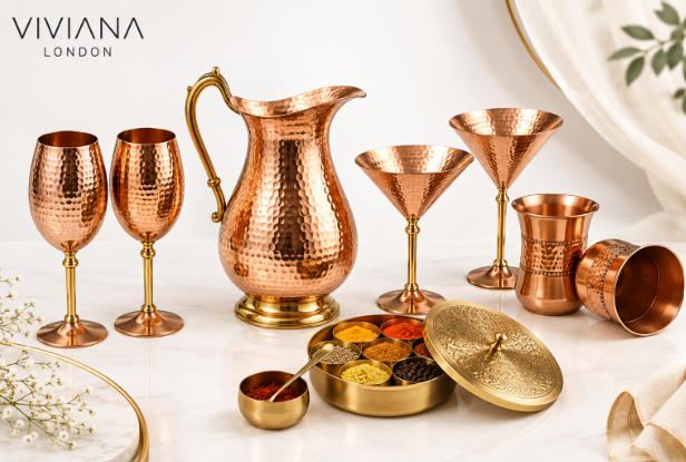 Handcrafted copper wine glasses, pitcher, and brass spice box by Viviana London for mindful slow living.